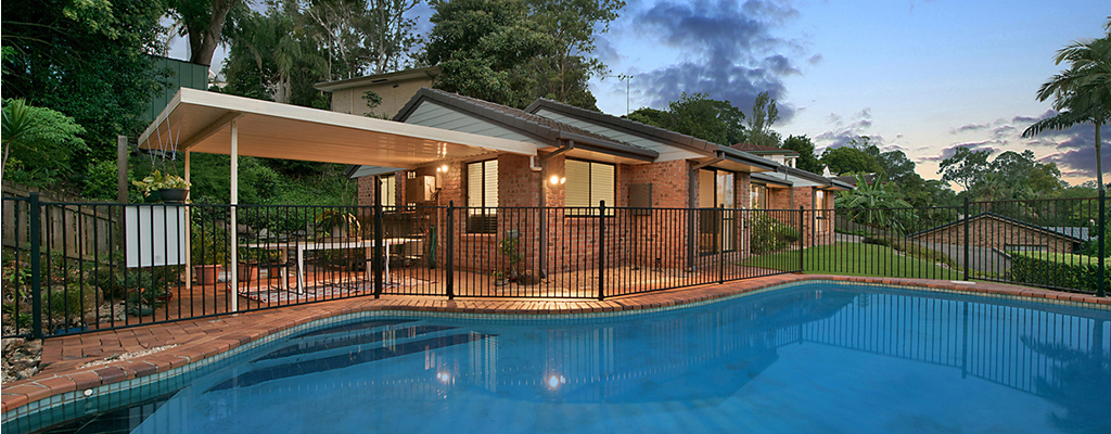 Brick house with pool overlooking real estate in Indooroopilly