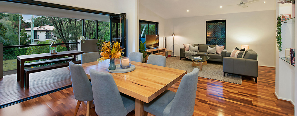 Real estate dining and lounge room looking out to Taringa